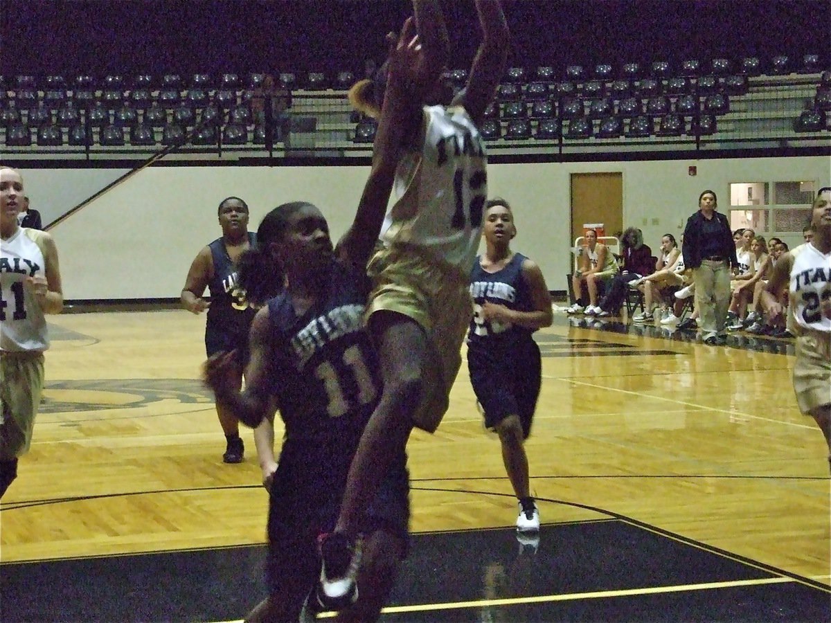 Image: Johnson jumps — Kortnei Johnson jumps over a Lady Lion.