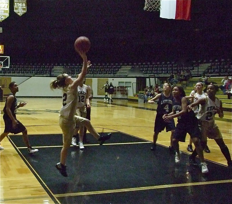 Image: Tara drives baseline — Tara Wallis(2) is a terror to opposing defenses as she drives the baseline against Dallas Life.