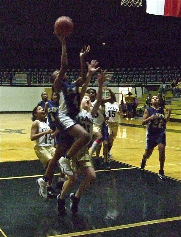 Image: Defense! — 8th graders Taylor Turner(31) and Ryisha Copeland(14) try to slow down a fast charging Lady Lion.