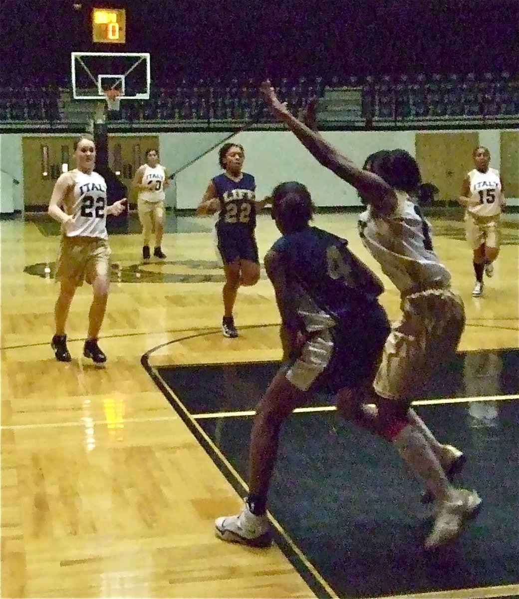 Image: Kendra covers — Kendra Copeland(13) tries to convince a Dallas Life player to pass the ball.