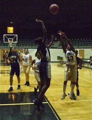 Image: Copeland shoots — Kendra Copeland(13) shoots over the head of a Lady Lion.