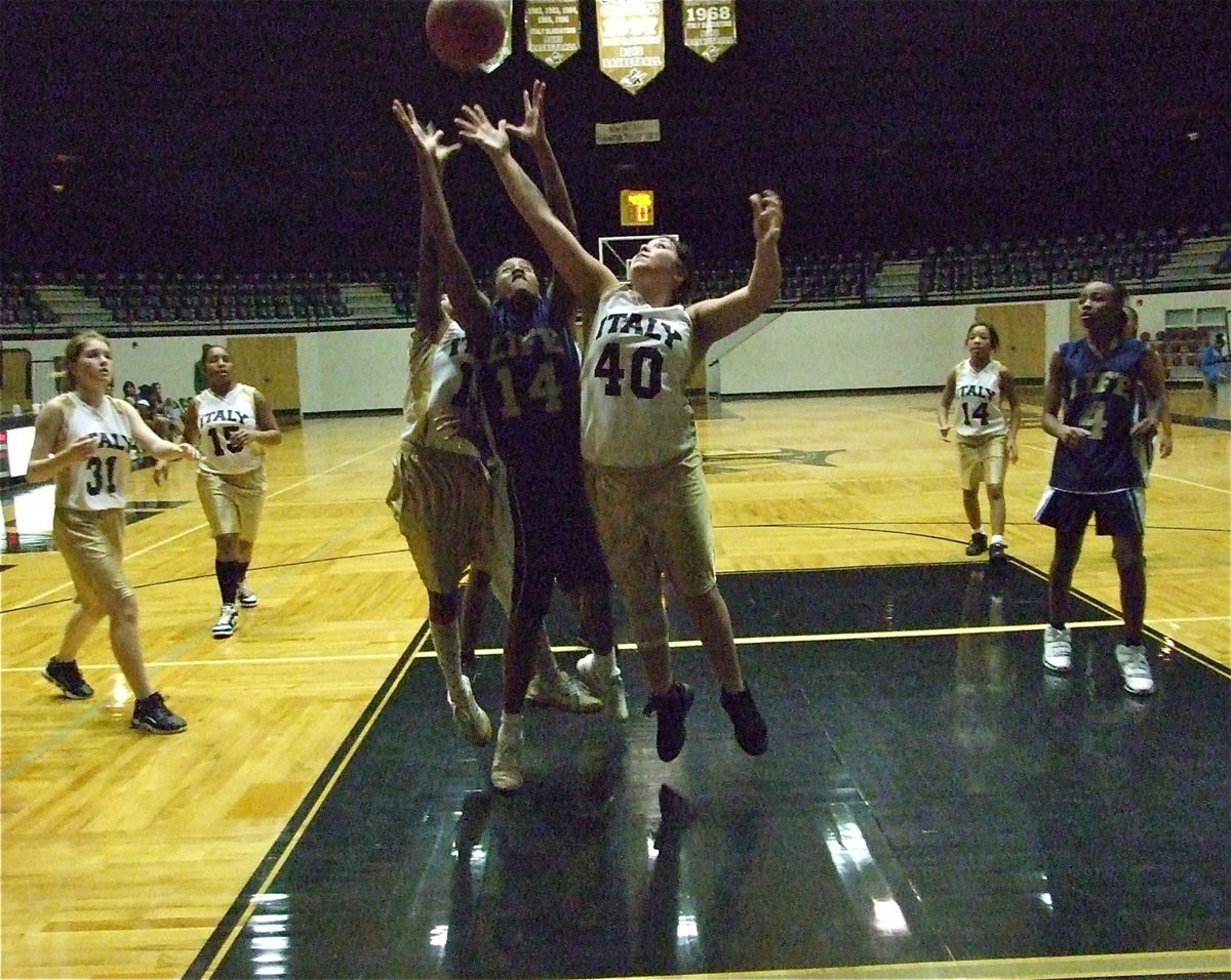 Image: Rebound! — Monserrat Figueroa(40) and teammate Kendra Copeland(13) try to grab the rebound as Taylor Turner(31), Ashley Harper(15) and Ryisha Copeland(14) move in.