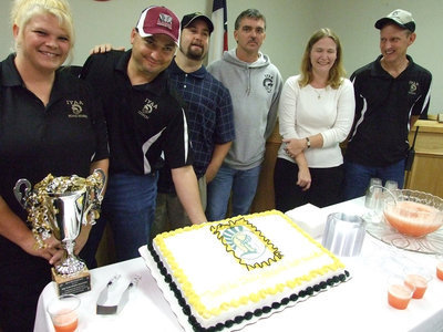 Image: IYAA Officers have fun — Micky Bland, Jason Escamillia, Barry Byers, Gary Wood, and Becky and Randy Boyd help celebrate the occasion with cake and punch.