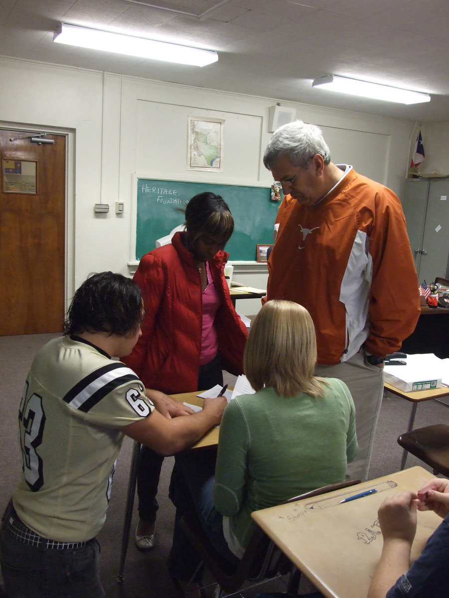 Image: Election workers tabulate — Coach Coleman and the senior government class takes care of the vote count.  Each was tabulated and carefully watched.