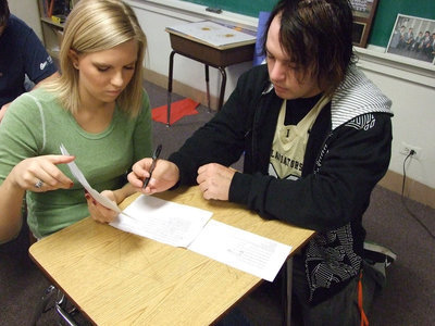 Image: Megan and Zach — Megan Hopkins and Zachary Hernandez carefully count the ballots.
