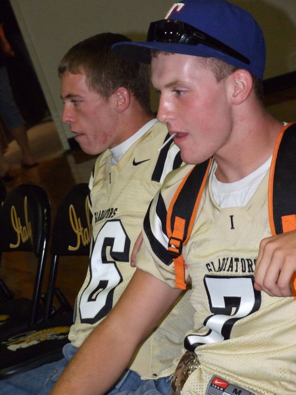 Image: Justin and Kyle — Justin Hayes and Kyle Wilkins relax at the pep rally before the game against Maypearl.