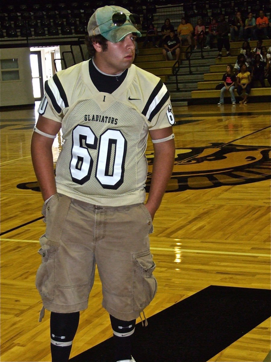 Image: Ivan Roldan — Lineman Ivan Roldan sports a cap and shades during the pep rally.