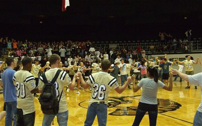 Image: The school song — The dome is filled with school spirit.