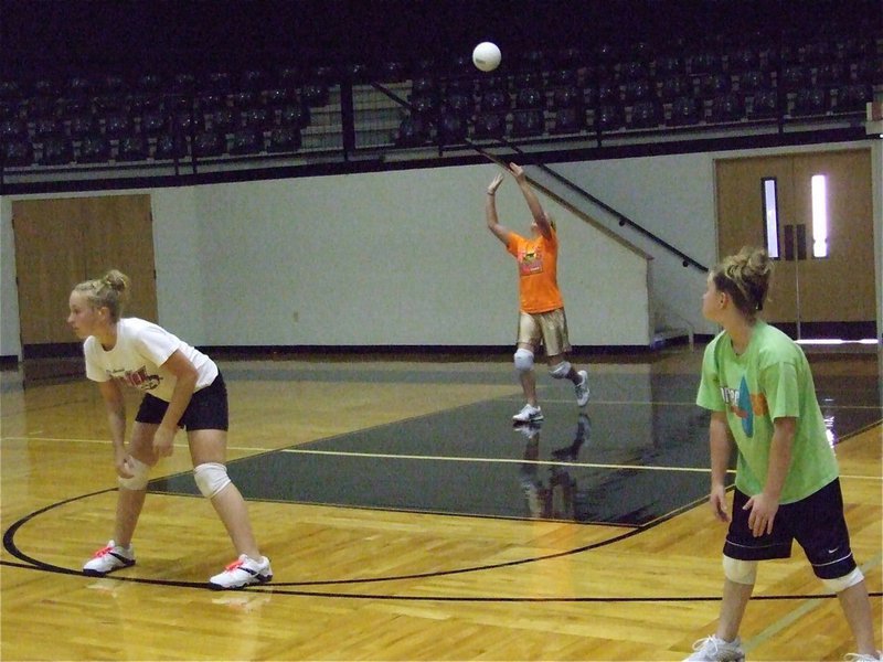 Image: Jac, Maddy and Tara — Madison Washington practices her killer serve during Monday’s practice.