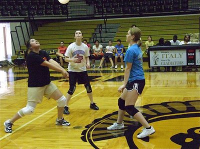 Image: Teamwork — 8th graders converge on the volleyball.