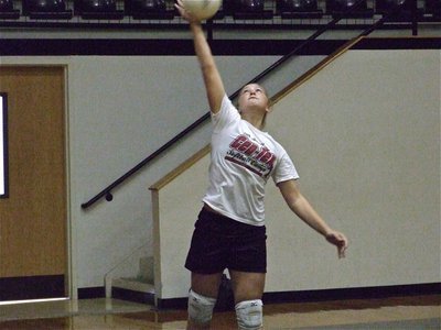 Image: Lewis lasers one — Jaclynn practices her power serve before the game against W.A.A.
