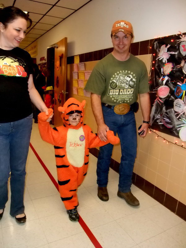 Image: And Tiger Too? — Parents and Tiger too enjoying the parade.