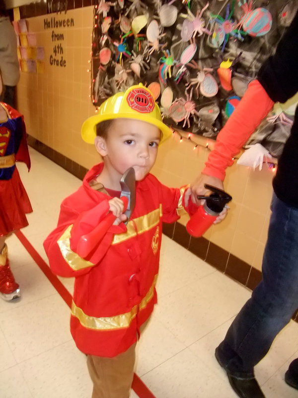 Image: Where’s the Fire? — Here is this Fireman armed and ready to put out fires.