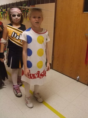 Image: Twister Anyone? — We have a Twister game and a scary cheerleader behind her.