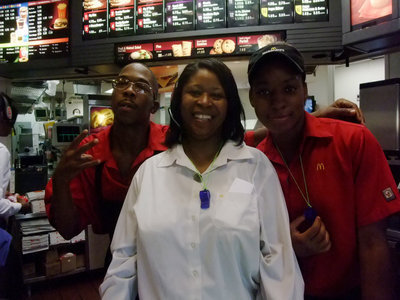 Image: McDonald’s Workers — Bemonica Nichols, Gena Elzy and Marshalaye Cole were very busy serving all the customers on McTeacher Night.