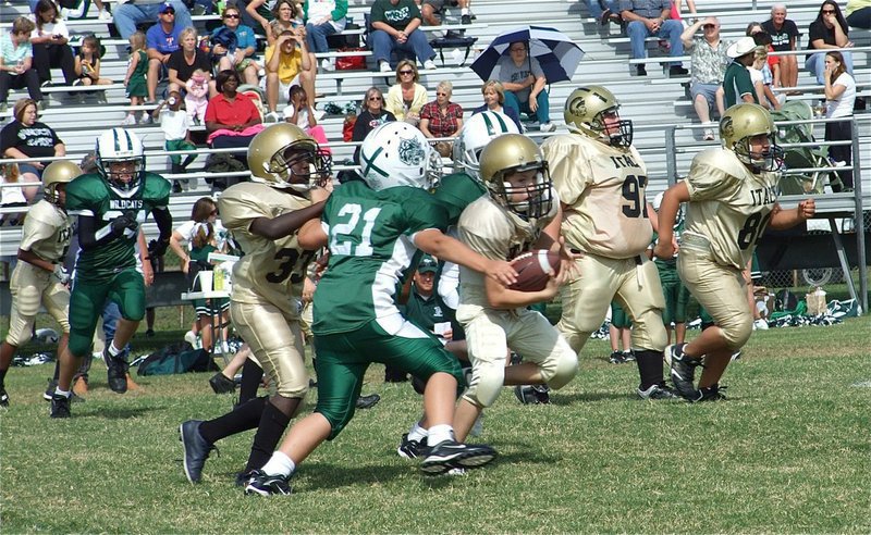 Image: Itson scampers — Ryder follows his blockers for valuable yardage.