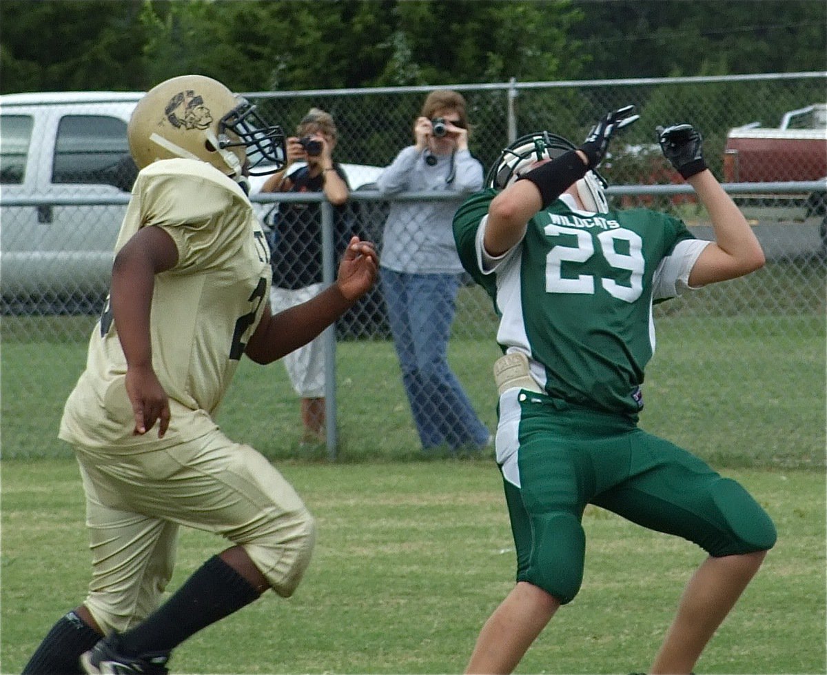 Image: Norwood covers — Linebacker, Ken Norwood, Jr., pressures the Wildcat receiver forcing the ball to fall incomplete in the Gladiator endzone.