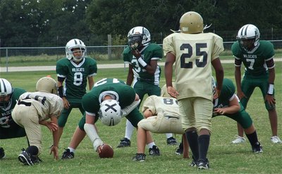 Image: Goal line stand — “X” marks the spot as Kenneth Norwood, Jr.(25) prepares to blitz the Wildcats while James McIntyre(10) and Isaac Salcedo(80) prepare to shoot the “A” gaps.
