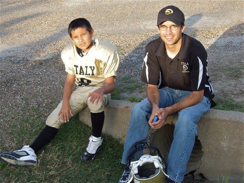 Image: Jacob sits with his dad