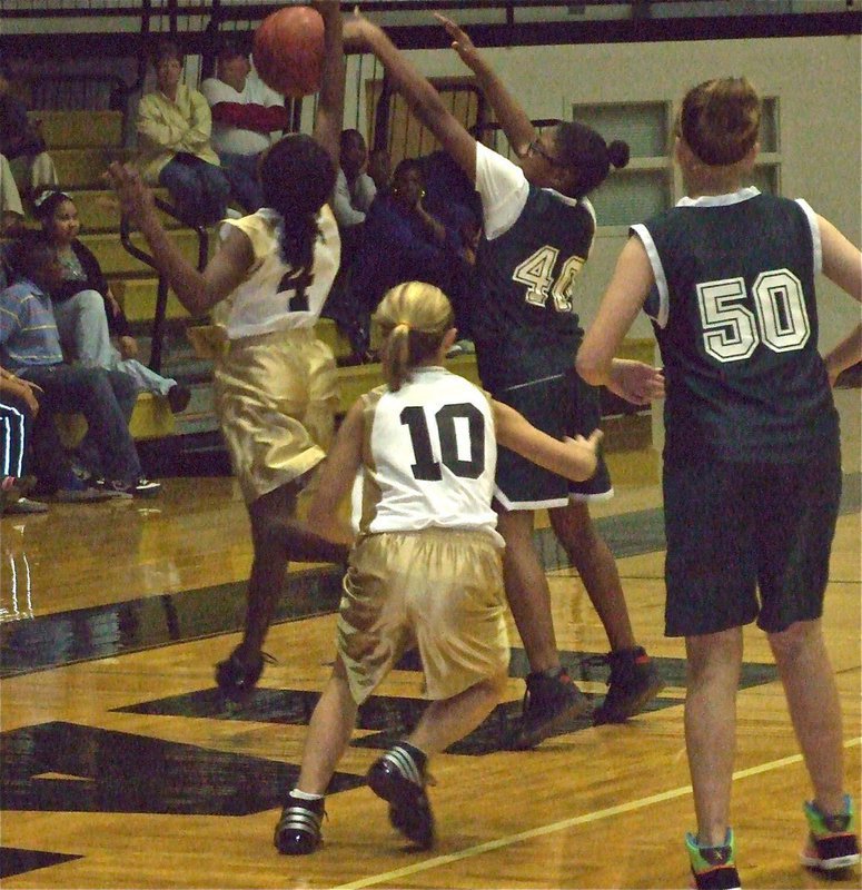 Image: Davis and Eubank — Bailey Eubank(10) plays tough defense while K’Breona Davis deflects the inbound pass.