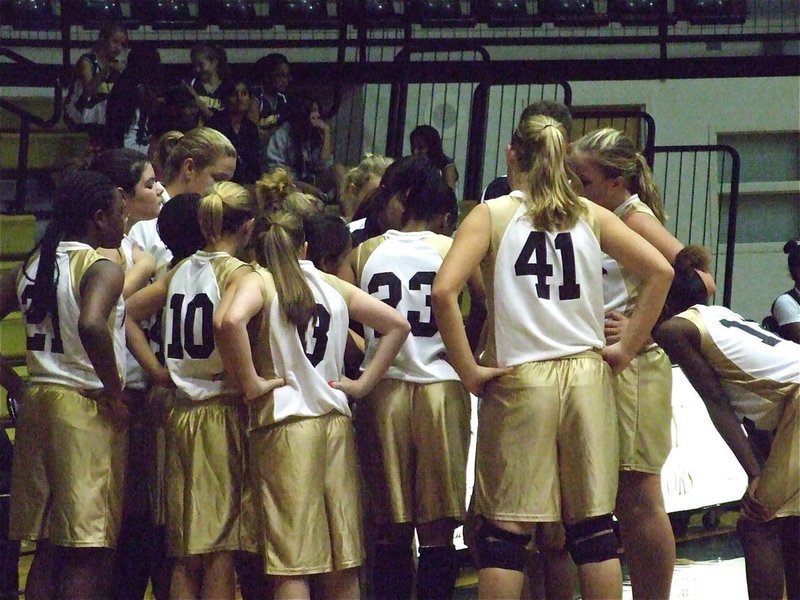 Image: Keep it going — Coach Tina Richards and Stacy McDonald huddle with the 7th grade girls.