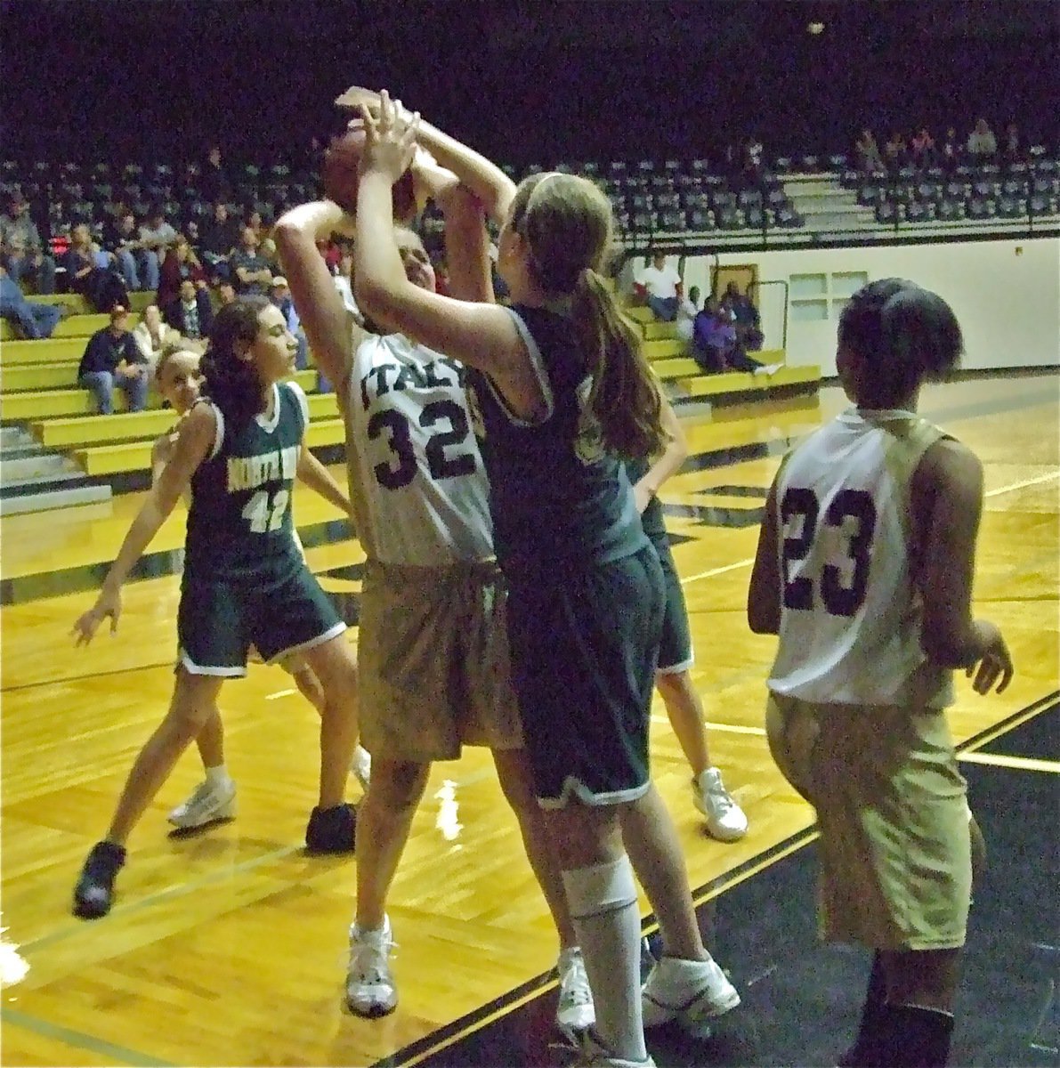 Image: Madison battles — Madison has her hands full with an INH defender as Tylar Wilson(23) and Mackenzie Goodwin-Davis(5) try to get open.