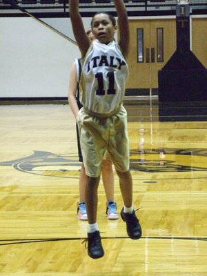 Image: Alex at the line — Alex Minton(11) hits a free throw against INH.