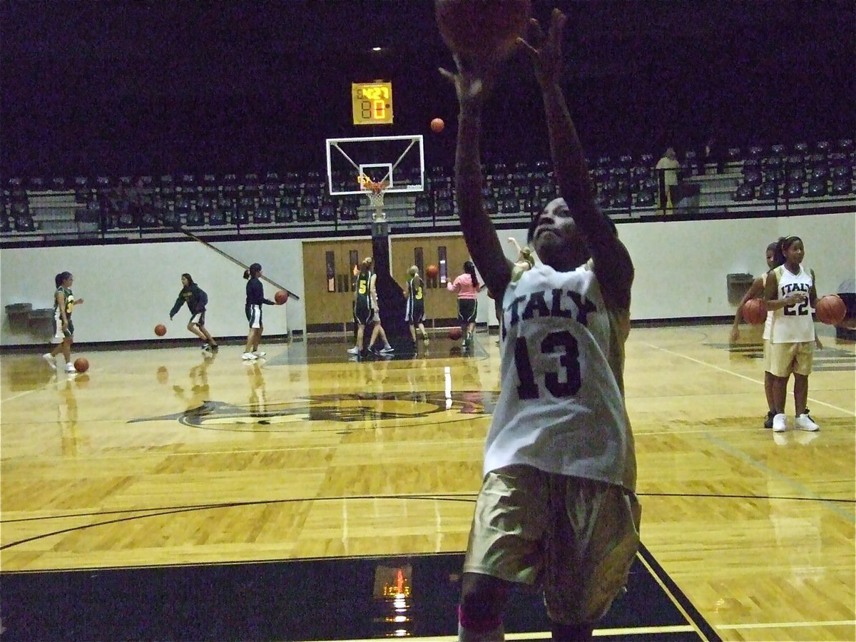 Image: Practice makes perfect — Kendra Copeland(13) practices her layup before the game.