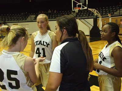 Image: Be Relentless — Coach Tina Richards talks defense with the 7th grade girls during a timeout.