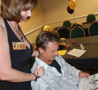 Image: Remembering when — Alison and her husband Ronnie Janek, who was a 1988 IHS Graduate, glance through the yearbook.