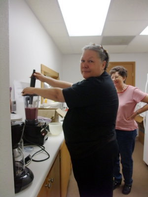 Image: P.J. Leible — P.J. Leible (club member) making grape smoothies to help in the celebration.
