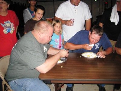 Image: Pie Eating Contest — Lance Finch (on left) won the pie eating contest. He was the fastest pie eater. Andy Frank gave it his best.