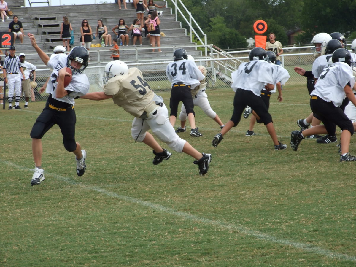 Image: John closes in — John Byers (54) has the Palmer quarterback on the run.