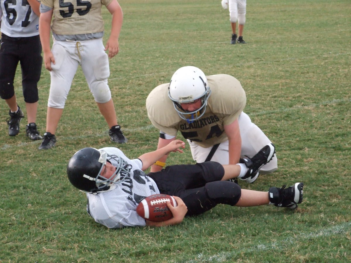 Image: Good Dawg! — John “Bulldawg” Byers (54) (half brahman, half pit) records a sack against the Bulldogs.