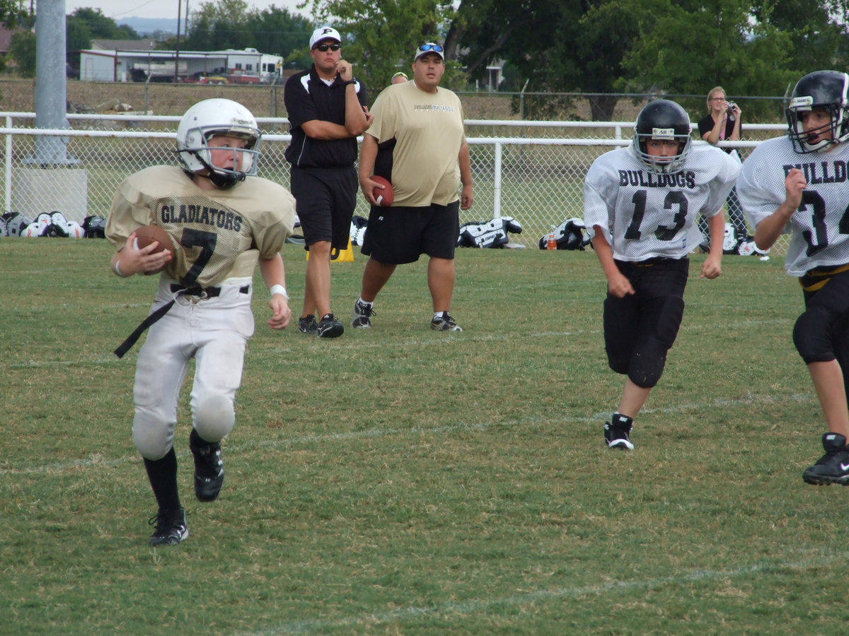 Image: Escamilla runs for it — It only took a second to decide to run instead of pass for this quarterback.