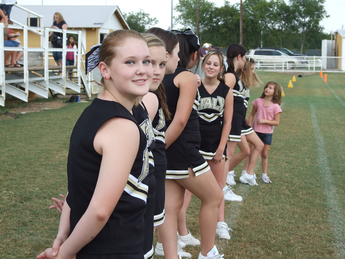 Image: Takes time for a pose — Jesica Wilkins stops cheering for a Kodak moment.