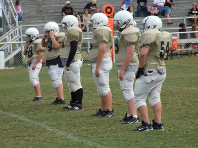 Image: No room to run… — …And no place to hide! The front six of the 7th Grade defensive line. From left to right: Fortenberry, Prator, Vencill, Bales, Hilliard and Byers.