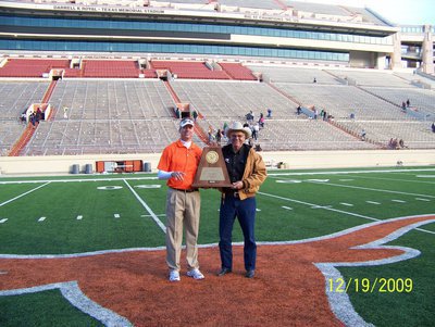 Image: Daniel &amp; Dad — Daniel Seay and his dad, David Seay, hold the 4A State Championship Trophy proud after the Aledo Bearcats defeated the Brenham Cubs 35-21.