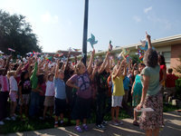 Image: Many, Many Pinwheels — Stafford students display their pinwheels with pride.
