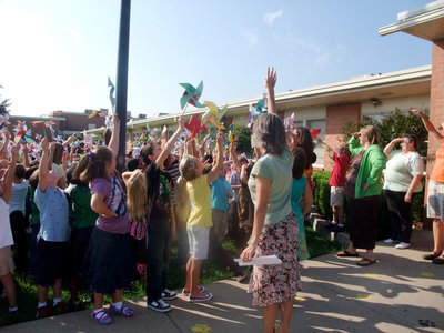 Image: Spin them high — The students made their pinwheels themselves and did a great job.