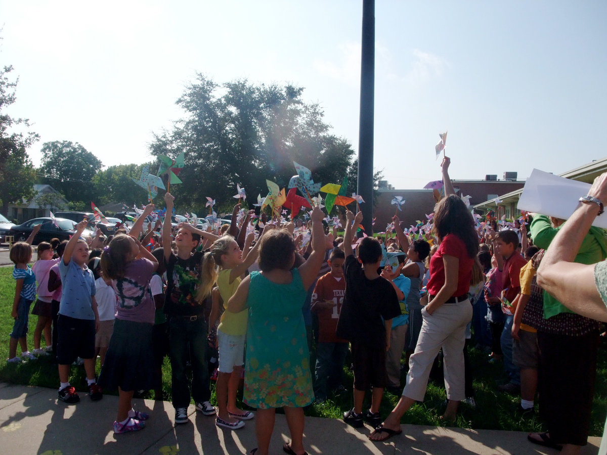 Image: Students Teachers and Parents — There were students, teachers and parents enjoying the pinwheels.