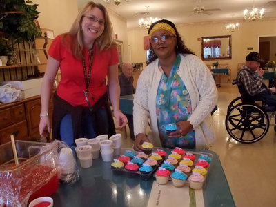 Image: Let’s Eat Cake — Amy May (restorative aid) and Lele Clemmons (house keeping) are helping out to make the birthdays a success!