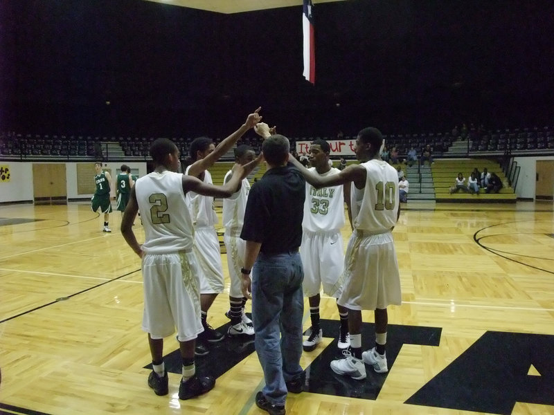 Image: Coach Holley  — Coach Holley and five Gladiators try to break Crossroads.