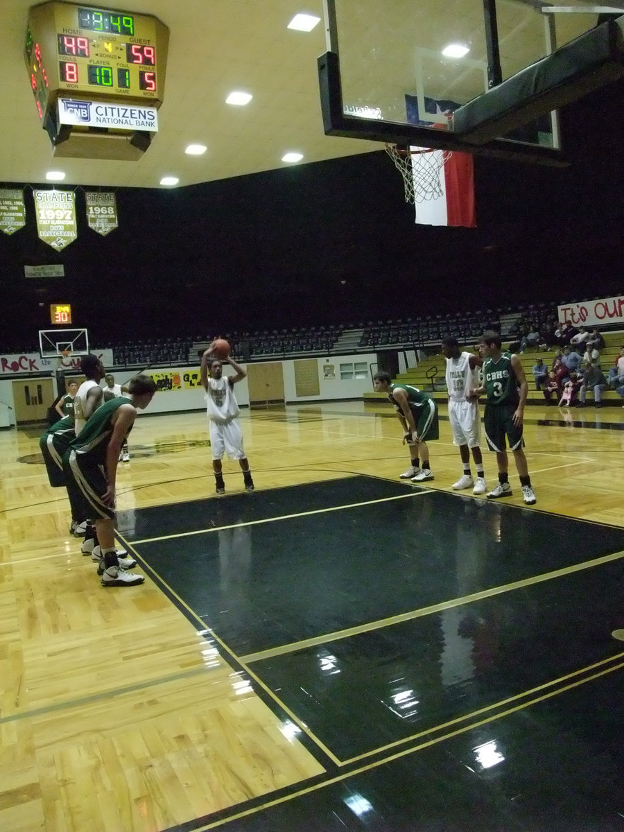 Image: Senior Dontavius Clemons — Senior Dontavius Clemons #5, concentrates on a free shot against Crossroads.