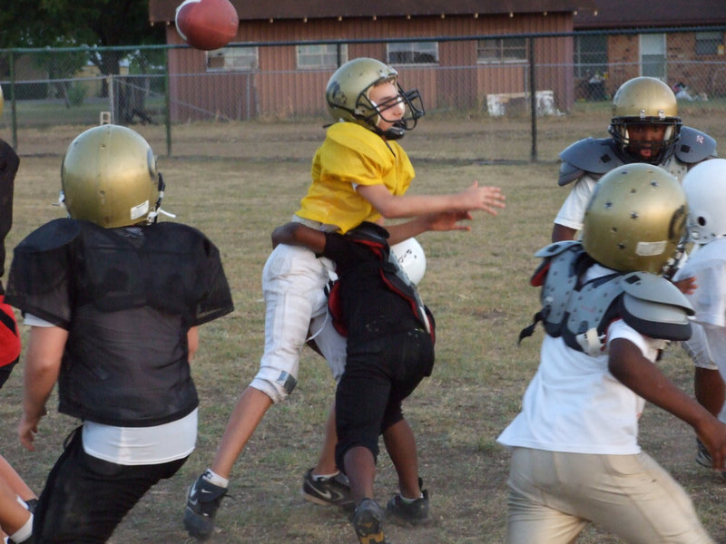 Image: 2009 IYAA Football gets cracking and tackling — A Monday scrimmage between the Majors (5th &amp; 6th grades) and the Minors (3rd &amp; 4th grades) sets the tone for a what looks to be a fast and furious season.