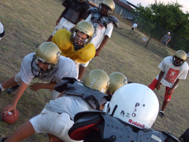 Image: The Dust Bowl — It’s calm before the snap, but once that ball is hiked, a dust storm will flare up.