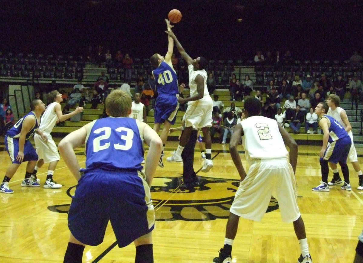 Image: Mayberry has the jump — Gladiator Larry Mayberry and Bulldog Josh Smith start the game.