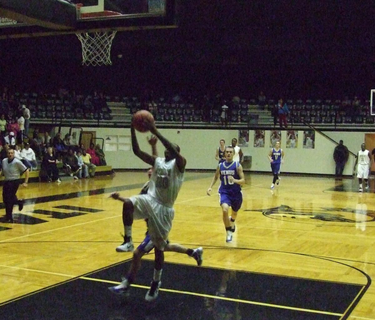 Image: Sephus scores — De’Andre Sephus gets to the basket first.