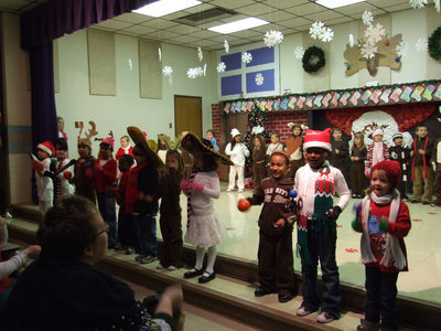 Image: “Feliz Navidad” — Stafford Kindergarten all dressed up singing “Feliz Navidad.”