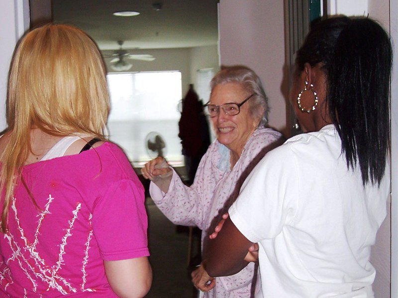 Image: On a mission — Teenagers from the Methodist Children’s Home take a moment to talk with Meals-on-Wheels client , Mary McVey of Waxahachie at one of their stops.